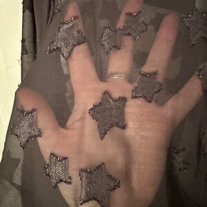 Torrid size 3 black sheer button up top with stars.